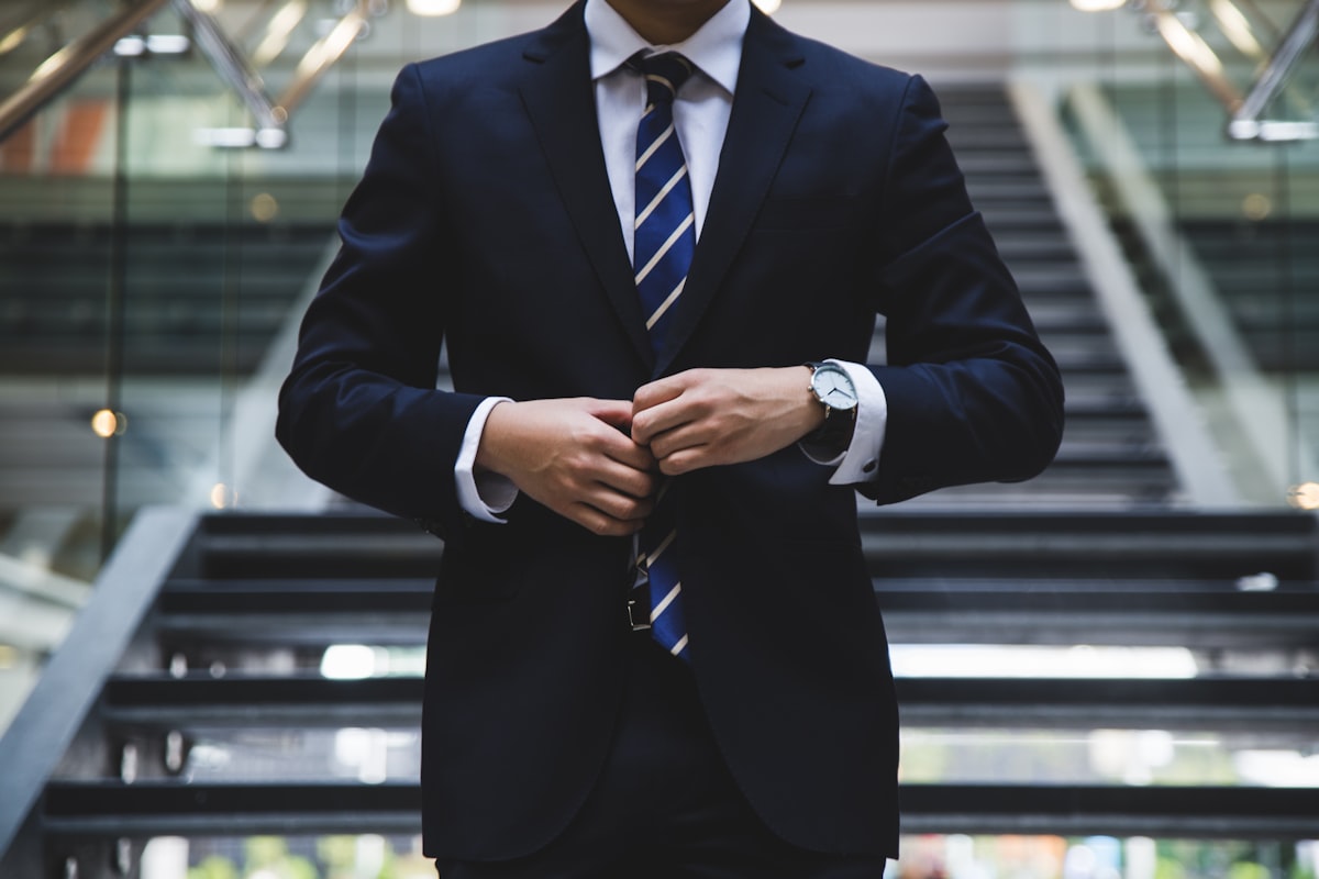 Businessman adjusting a tie